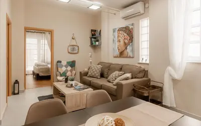 a living room with a couch and a table at Monastiraki Urban Apartments in Athens