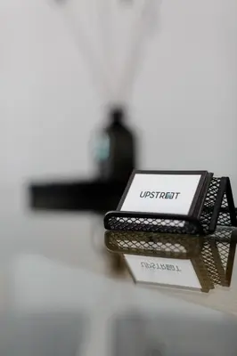 a cell phone sitting on top of a table at Urban 2BD Apartment in Koukaki by UPSTREET in Athens