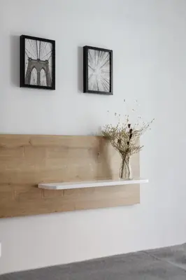 a shelf on a wall with a vase on it at Urban 2BD Apartment in Koukaki by UPSTREET in Athens