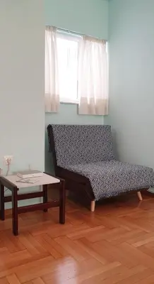 a bed and a coffee table in a room at Koukaki apartment near Acropolis in Athens