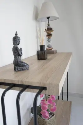 a table with a lamp and flowers on it at Breathtaking view penthouse at the heart of Thiseio, VP homes in Athens