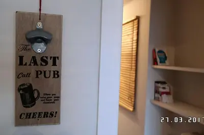 a door with a last call pub sign on it at Comfy Apartment With Acropolis View in Athens