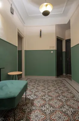 an empty room with green walls and a green couch at Athens Market Portrait in Athens