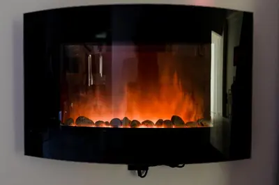 a fireplace with a bunch of rocks in it at Luxury apartment in Glyfada(near metro station)C82 in Athens