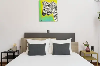 a bedroom with a bed with a zebra painting on the wall at Luxury apartment in Glyfada(near metro station)C82 in Athens