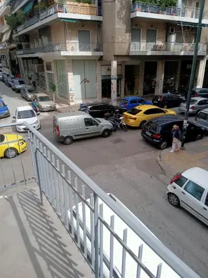 a group of cars parked in a parking lot at Koukaki-Acropolis roomy with a private veranda apt. in Athens
