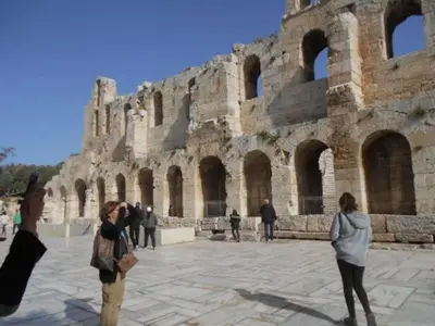 a group of people standing in front of a building at Koukaki-Acropolis roomy with a private veranda apt. in Athens