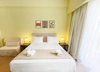 a bedroom with two beds with towels on them at ATHENS STORIES in Athens