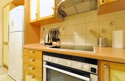 a kitchen with a stove and a refrigerator at Courtyard Apt - Central Athens in Athens