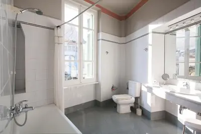 a bathroom with a toilet and a sink and a shower at House at the Foothills of Acropolis in Athens