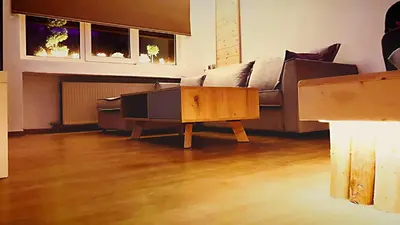 a living room with a couch and a coffee table at Boutique Athensairport Apartments in Markopoulo