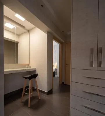 a stool sitting in a kitchen with a counter at 12 Keys Athens Apartments in Athens
