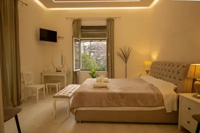 a bedroom with a bed and a window and a desk at ATHENS City Center Historical Area in Athens