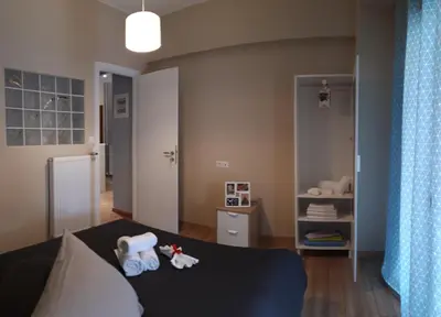 a room with a bed with towels on it at Renovated apartment close to Exarchia square in Athens