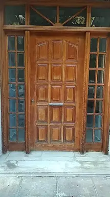 an old wooden door with glass windows on a building at Lemontree in Athens