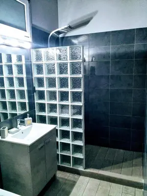 a bathroom with a shower and a sink and a shower at New seafront studio in Anavissos