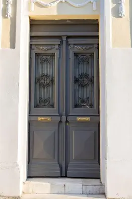 a pair of blue doors in a building at One Three One - In the Heart of Athens in Athens