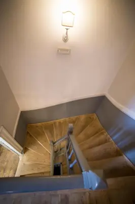 an overhead view of a staircase in a building with a light at One Three One - In the Heart of Athens in Athens