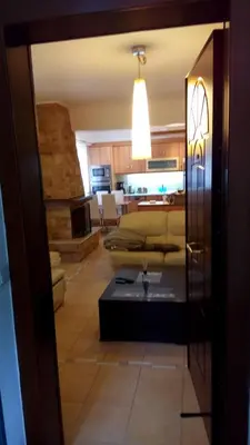 a living room with a couch and a table at Luxury Apartment in Ano Glyfada in Athens