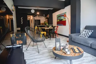 a living room with a couch and a table at Home Plus Psirri Apartment in Athens