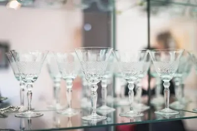 a group of wine glasses sitting on a glass table at Seaside Central Apartment in Athens