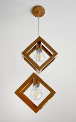a chandelier with two lights hanging from a ceiling at Koukaki Edge Penthouse•Acropolis & Filopappou view in Athens
