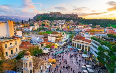 a view of a city with people walking in the street at Athena's Home, Sunny Balkony 100m from metro! in Athens