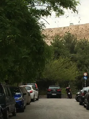 a bunch of cars parked in a parking lot at Angel Promachos by Acropolis in Athens
