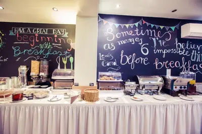 a table with a buffet of food on it at Hotel Marina in Athens