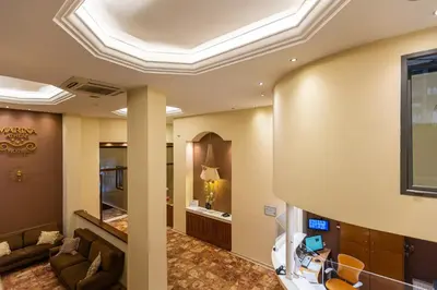 a living room with a coffered ceiling at Hotel Marina in Athens
