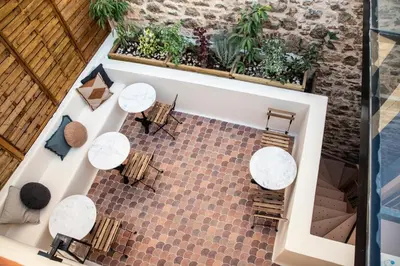 an overhead view of a restaurant with tables and chairs at Monsieur Didot in Athens