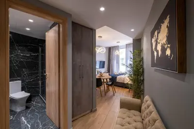 a hallway with a living room and a dining room at Amazing Apartments @ Monastiraki Subway Station in Athens