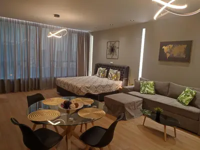 a living room with a couch and a table at Amazing Apartments @ Monastiraki Subway Station in Athens