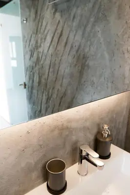 a bathroom with a sink with a mirror and a sink at V36 Suites in Athens