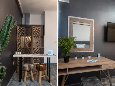 a dining room with a table and a mirror at Amazing Apartments @ Aiolou Str. in Athens