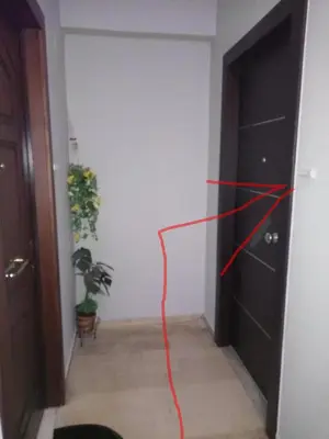 a room with a door with a red string on it at Cozy studio near Victoria metro station in Athens