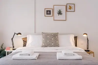 a bedroom with a bed with two towels on it at Wide Comfy Studio Apartment Centrally Located In Thissio in Athens
