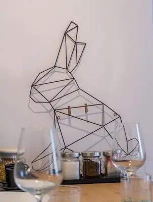 a sculpture of a rabbit is on a table with glasses at Wide Comfy Studio Apartment Centrally Located In Thissio in Athens