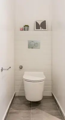 a white bathroom with a toilet in a room at Wide Comfy Studio Apartment Centrally Located In Thissio in Athens