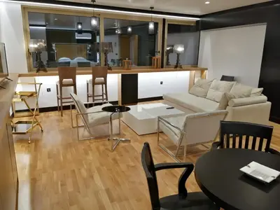 a living room with a couch and a table at Andromeda Downtown Residence in Athens