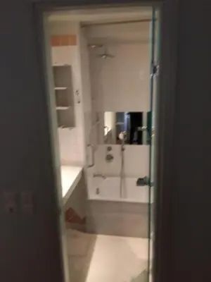 a bathroom with a shower and a sink and a mirror at Deluxe Apartment Best Point in Athens