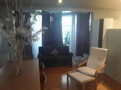 a living room with a chair and a couch at Deluxe Apartment Best Point in Athens