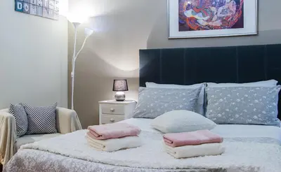 a bedroom with a bed with pillows on it at City Stay Alexandras Av. in Athens