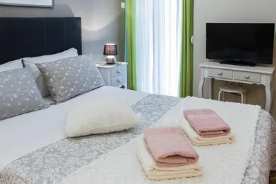 a bedroom with a bed with two towels on it at City Stay Alexandras Av. in Athens