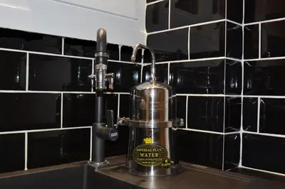 a kitchen sink with a water dispenser on a counter at Lyto by Heloni Apartments in Athens