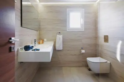 a bathroom with a white sink and a toilet at Alke Homme II in Athens