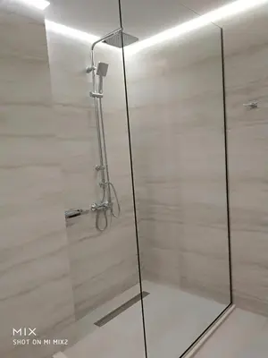 a shower with a glass door in a bathroom at Alke Homme II in Athens