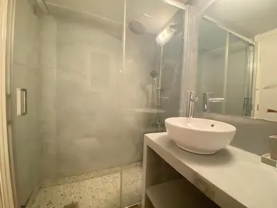 a bathroom with a white sink and a shower at Athens City Themis 7 in Athens