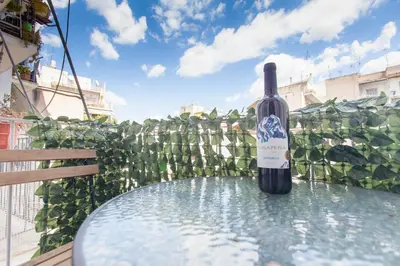 a bottle of wine sitting on top of a table at Athens City Themis 7 in Athens