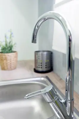a kitchen sink with a faucet on a counter at Athens City Themis 7 in Athens